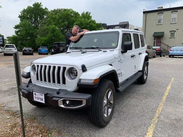 David Saunders hugs his awesome new Jeep!