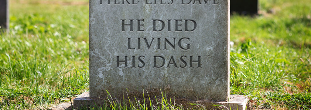 Tombstone that reads. "He Dies Living His Dash""